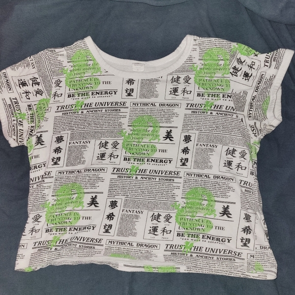 Angel Energy cropped newspaper print shirt with green dragons on it - Picture 1 of 3